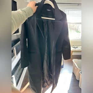 Pea coat. Very warm. Looks great with jeans and sneakers & t shirt.